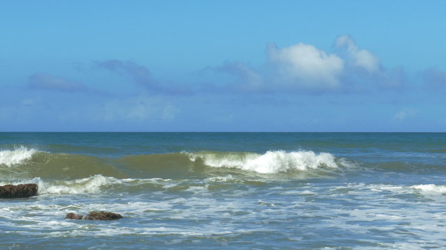 Panning view of a tranquil scene at a Caribbean coastline with waves hitting the rocks. Image taken with a Panasonic FZ-1000 with Leica lens. in Chuspa, Venezuela.