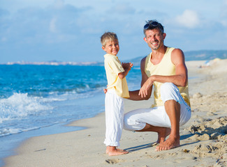 Fototapeta premium Father and son on beach