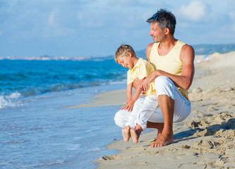 Father and son on beach