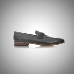 Fashion concept with male shoes against gradient 