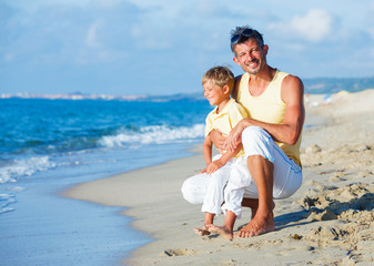 Father and son on beach