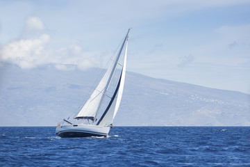 Wind in yacht sails with beautiful sky. Luxury yachts.