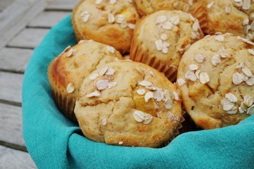 Homemade peach oatmeal muffins in a basket