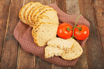 A loaf of corn bread and tomatoes © lucky_marinka