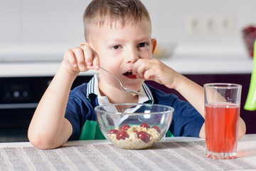 Boy Eating Bowl of Cereal for Breakfast