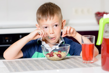 Boy Eating Bowl of Cereal for Breakfast