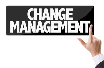 Businessman pressing button with the text: Change Management