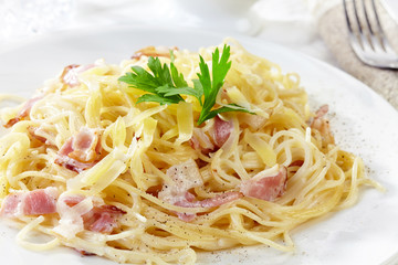 pasta carbonara on white plate