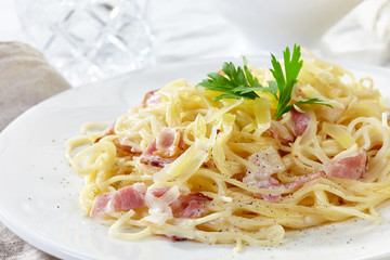 pasta carbonara on white plate