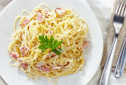 pasta carbonara on white plate
