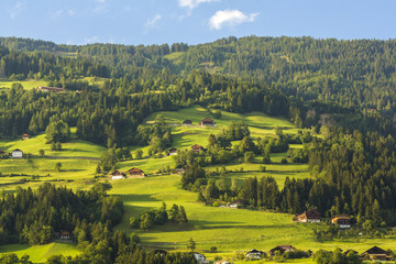Austrian landscape with meadows and mountains in the summertime