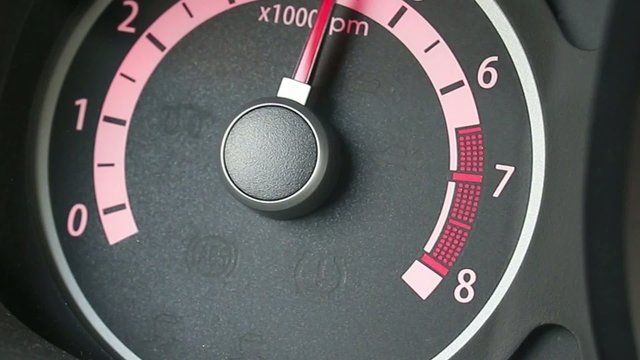Car tachometer and moving pointer on it.