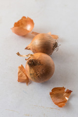 Onions on white table