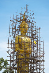 Golden Buddha statue under construction.