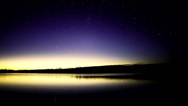 Stars and Sunrise over Pond