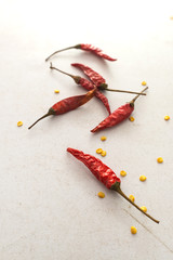 dried chilies on the white floor