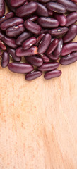 Red kidney beans on wooden background