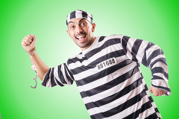 Convict criminal in striped uniform