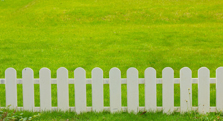 wooden fence in the grass.