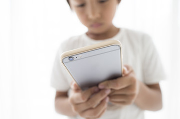 Boy playing with smartphone