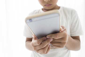 Boy playing with smartphone