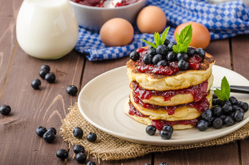 Glutten-free pancakes with jam and blueberries