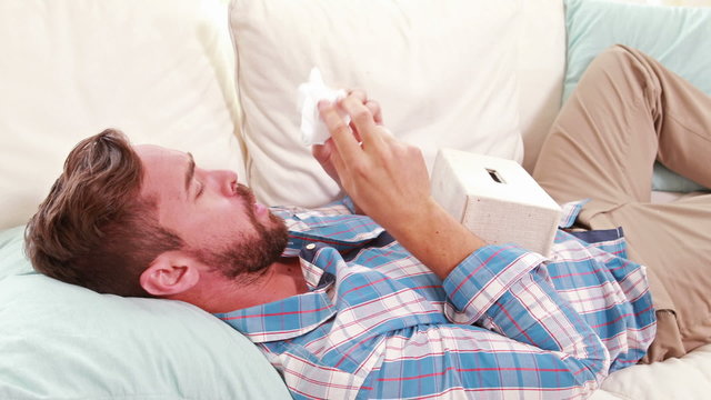 A sick man in the sofa 
