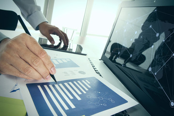 business documents on office table with smart phone and digital