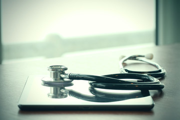 Studio macro of a stethoscope and digital tablet with shallow DO