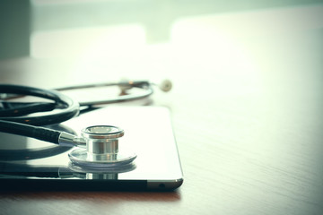 Studio macro of a stethoscope and digital tablet with shallow DO