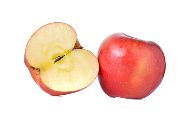whole and half cut red apples with stem on white background