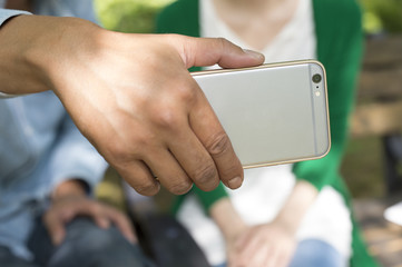Men showed a smartphone to women