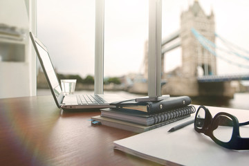 laptop computer is on wooden desk as workplace concept with over