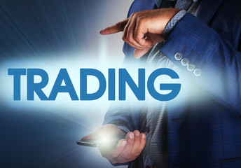 Businessman presses button trading on virtual screens. Business,