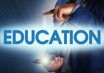 Businessman presses button education on virtual screens. Busines