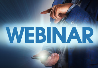 Businessman presses button webinar on virtual screens. Business,