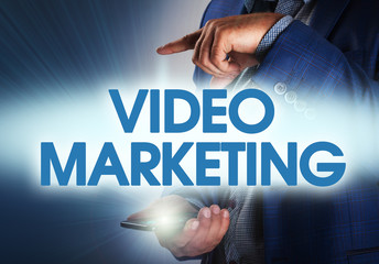 Businessman presses button video marketing on virtual screens. B