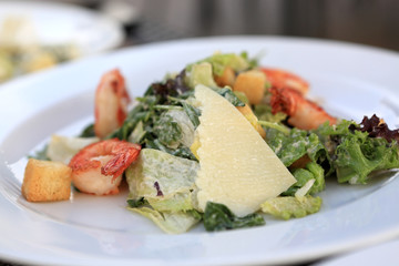 Plate of Caesar salad with shrimps