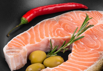 Frying pan with salmon steak. 