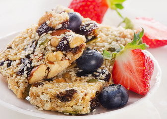 Healthy fruit and nut granola bars on a plate