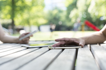 The couple sitting face to face in the park