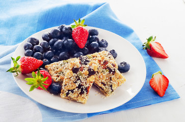 Granola bars with fresh berries for a breakfast.