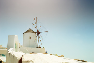 Windmill in Oia town. White architecture on Santorini island, Gr