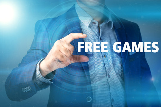 Businessman presses button free games on virtual screens. Busine