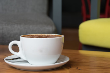 hot coffee on wood table