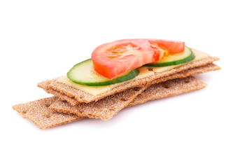 Crackers with fresh vegetables and cheese