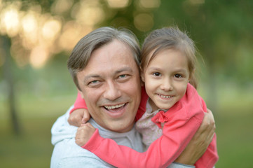 Fototapeta na wymiar Happy Caucasian father holding his daughter 