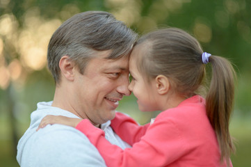 Fototapeta premium Happy Caucasian father holding his daughter 