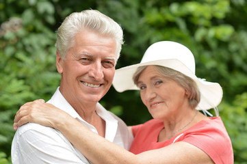 Senior couple in summer forest