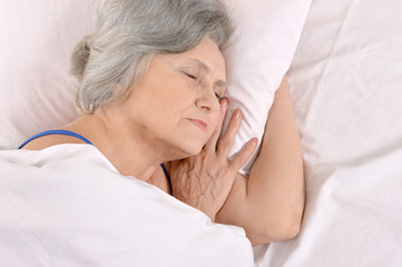 older woman sleeping in the bedroom